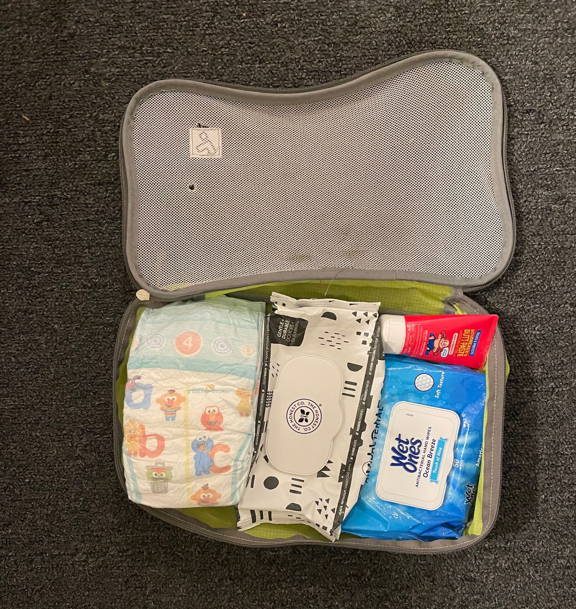 Diaper bag for traveling with an infant