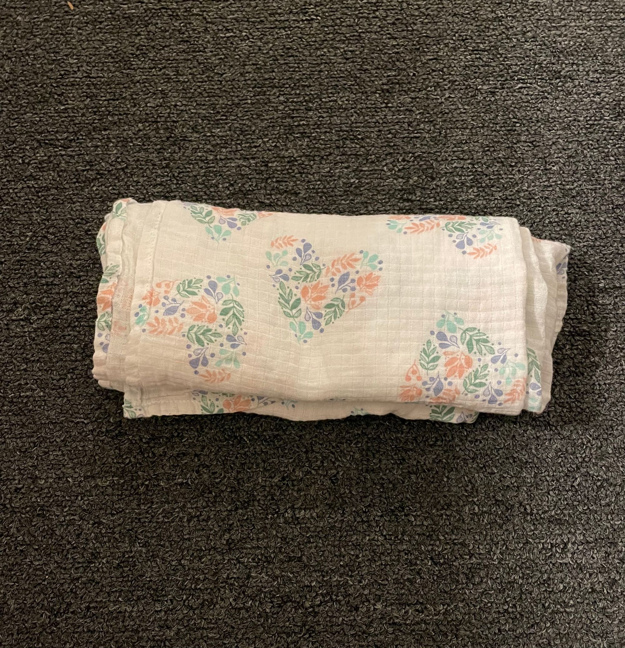 Muslin blanket used for traveling with an infant