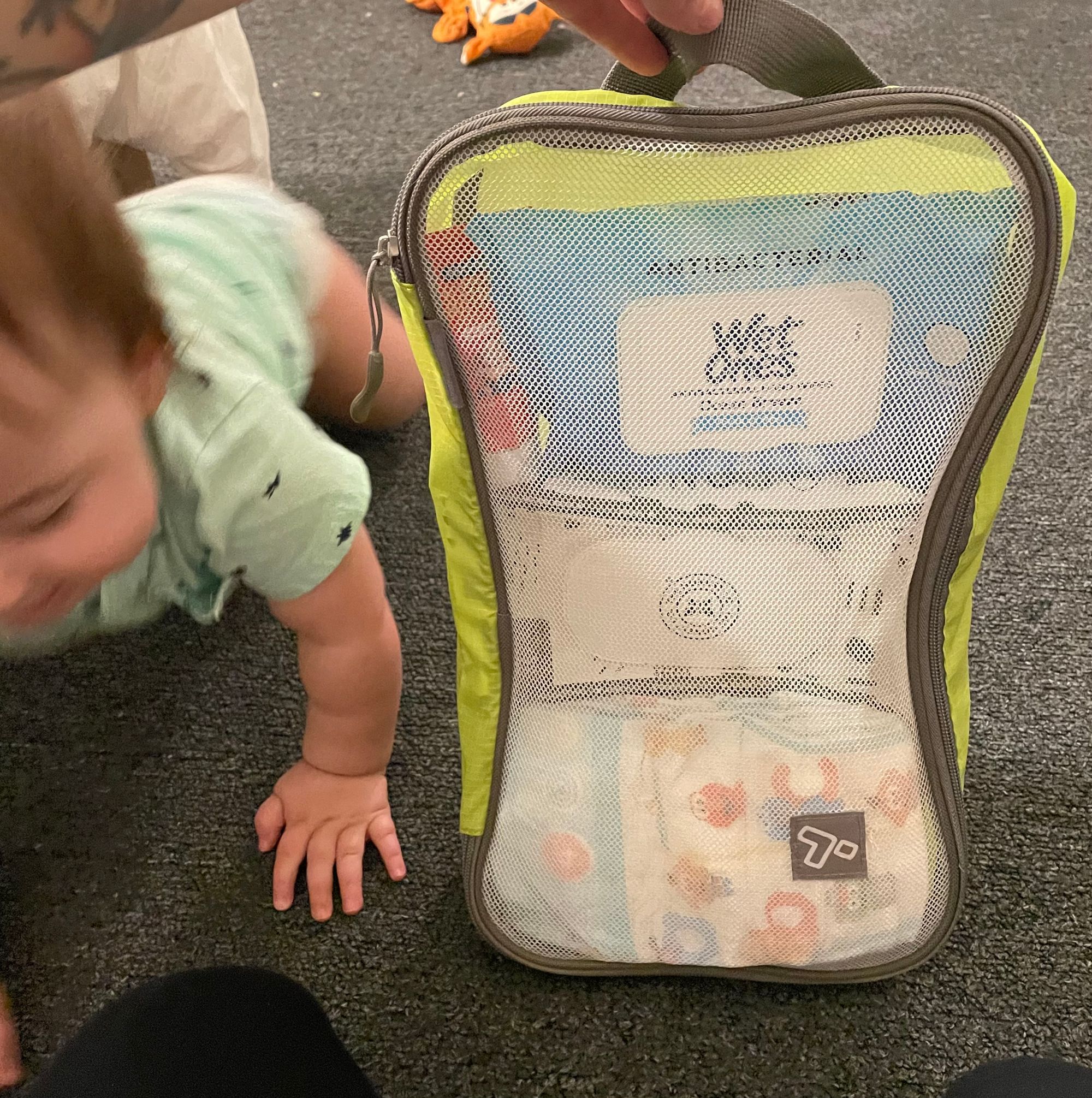 Diaper bag for traveling with an infant