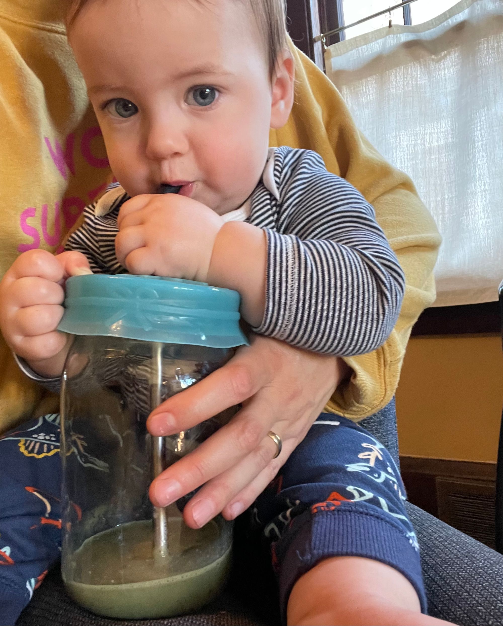 Infant drinking a smoothie